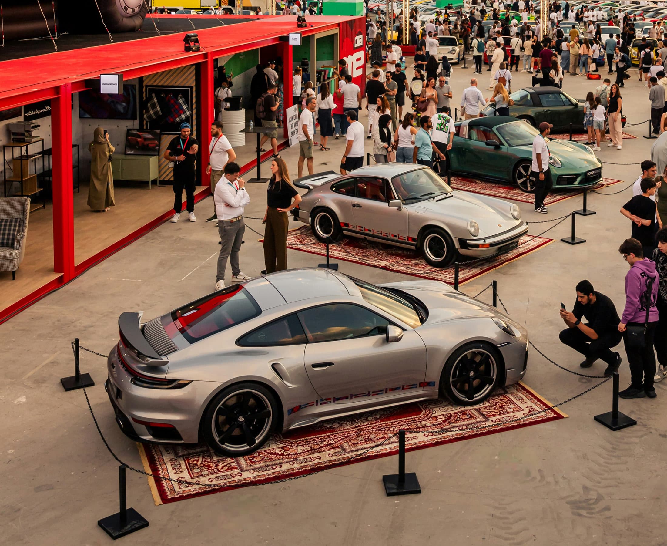 Cars and attendees gathered at a car meet